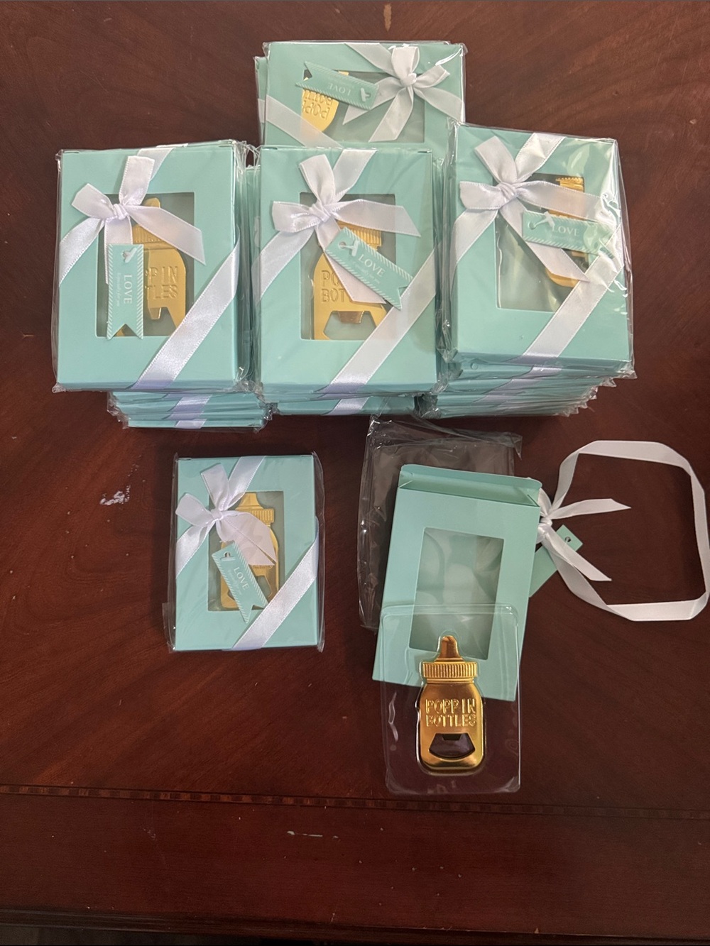 Amazon Aqua Favor Boxes with White Ribbon and Gold Baby Bottle Opener